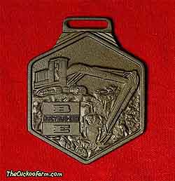 Bucyrus-Erie tracked excavator - Binder Machinery watch fob