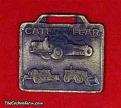 A Caterpillar trio - Ohio Machinery Co. watch fob