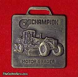 Champion motor grader watch fob