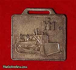 International Harvester tracked dozer - Edward Ehrbar Inc. watch fob